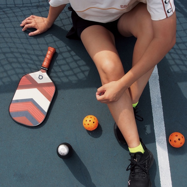 pickleball paddle, pickleball ball, pickleball equipment, pickleball gear, pickleball court, sports paddle, product demo, lifestyle, outdoor, energetic, fresh, blue, orange, neutral